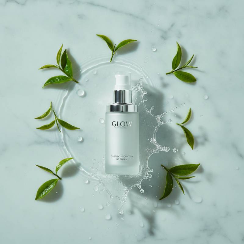 Green tea leaves and water droplets showing the natural ingredients of glow BB cream