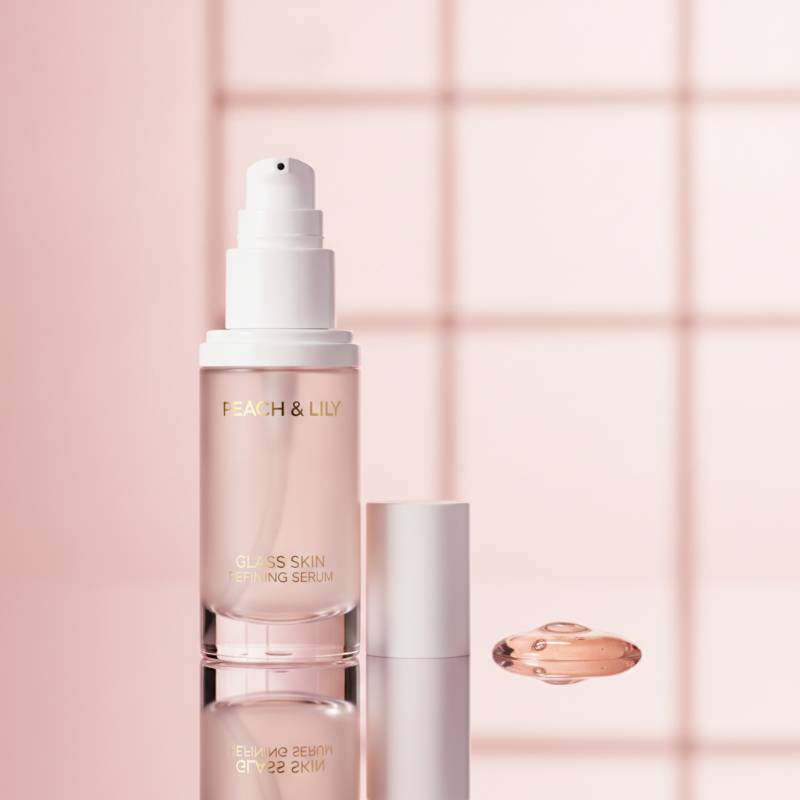 Peach and Lily Glass Skin Refining Serum bottle showing its clear gel texture